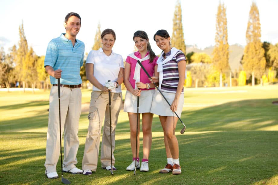 Happy Group Of Golf Players Outdoors And Smiling