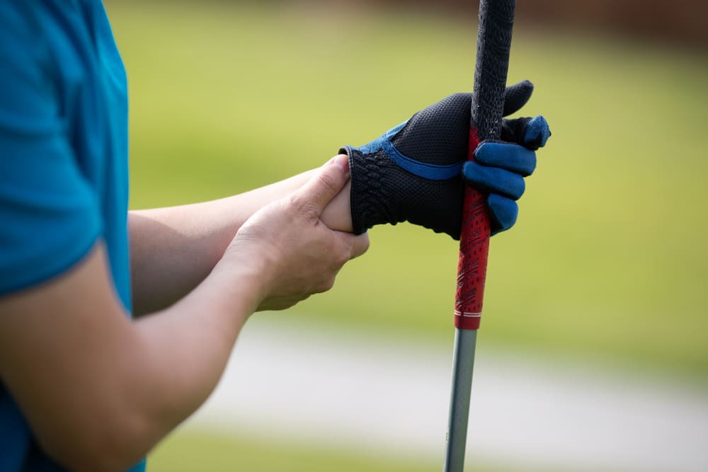 Male Golfer Has A Hand Pain After Finish Golfing