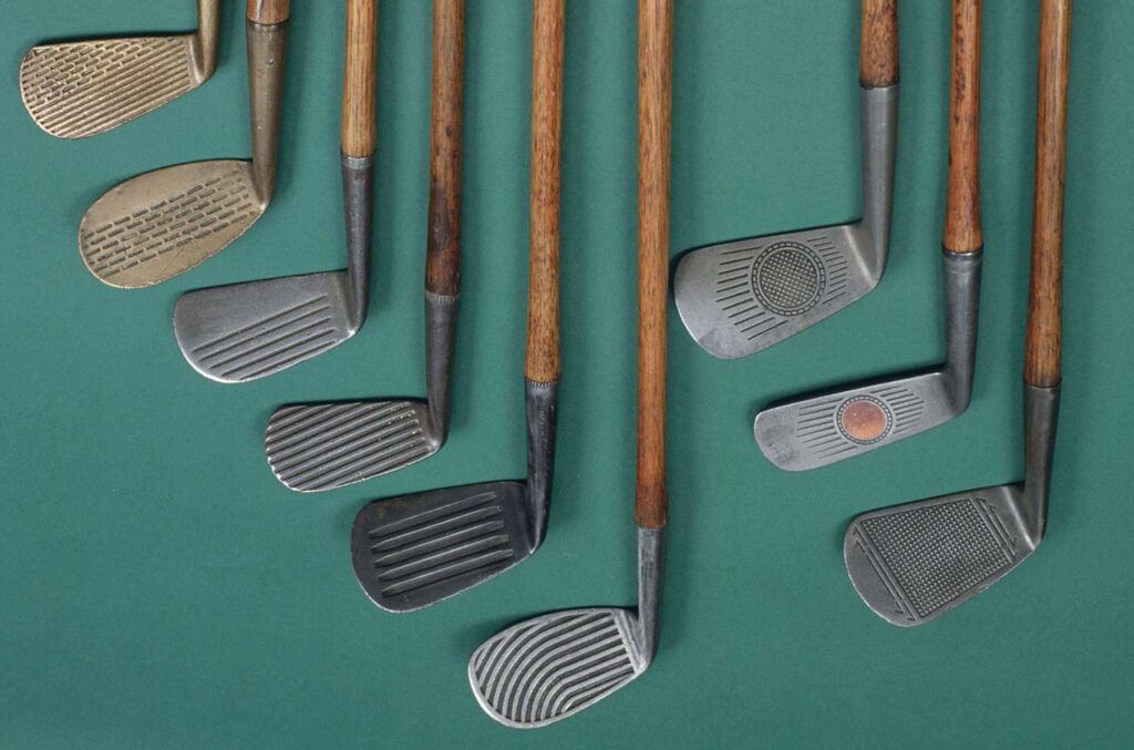 A top view of few golf clubs placed