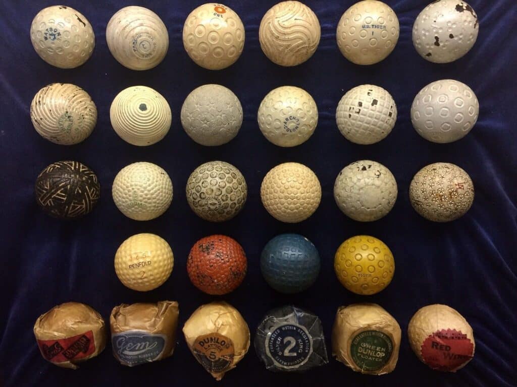 A top view of old golf balls placed