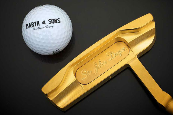 Barth and sons golden golf club with a Barth and sons golf ball