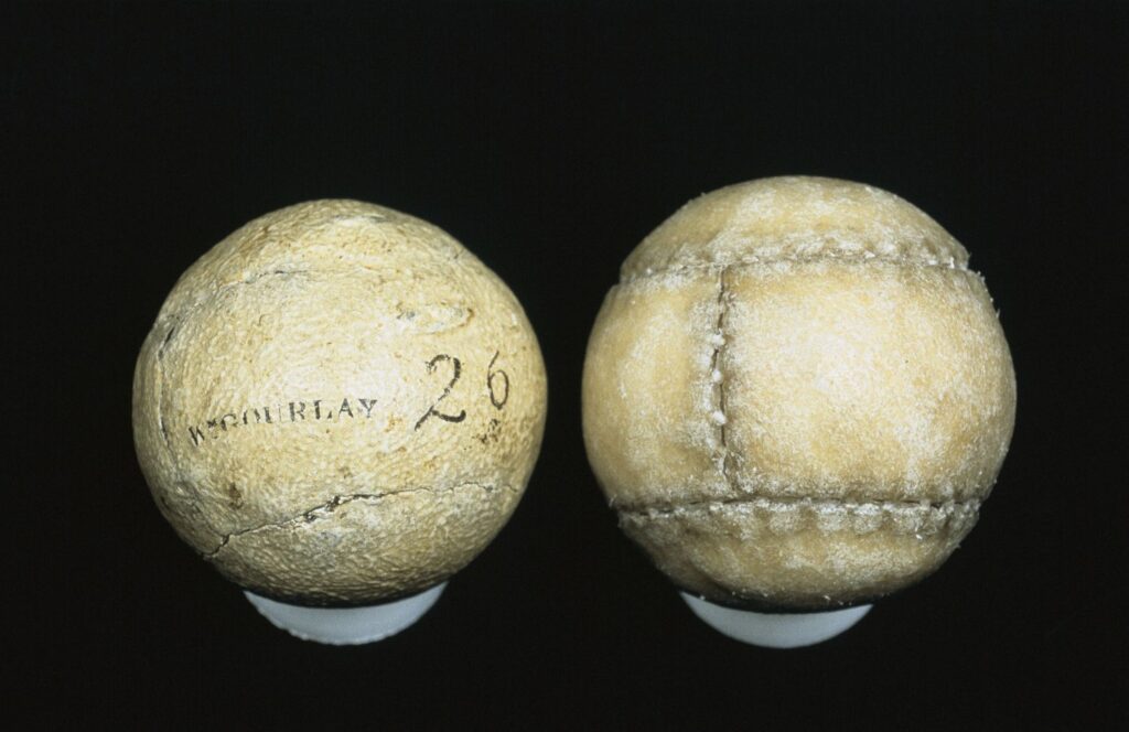 Top view of two old white featheries golf balls