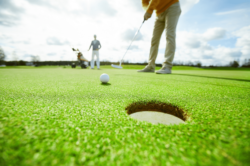 A close view of a golf ball hole