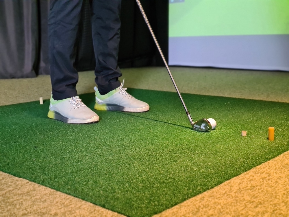 A view of a person hitting a golf ball