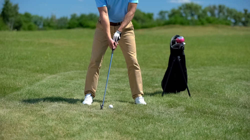 Confident Golf Player Teeing Off Ball Practicing Shots Before Competition