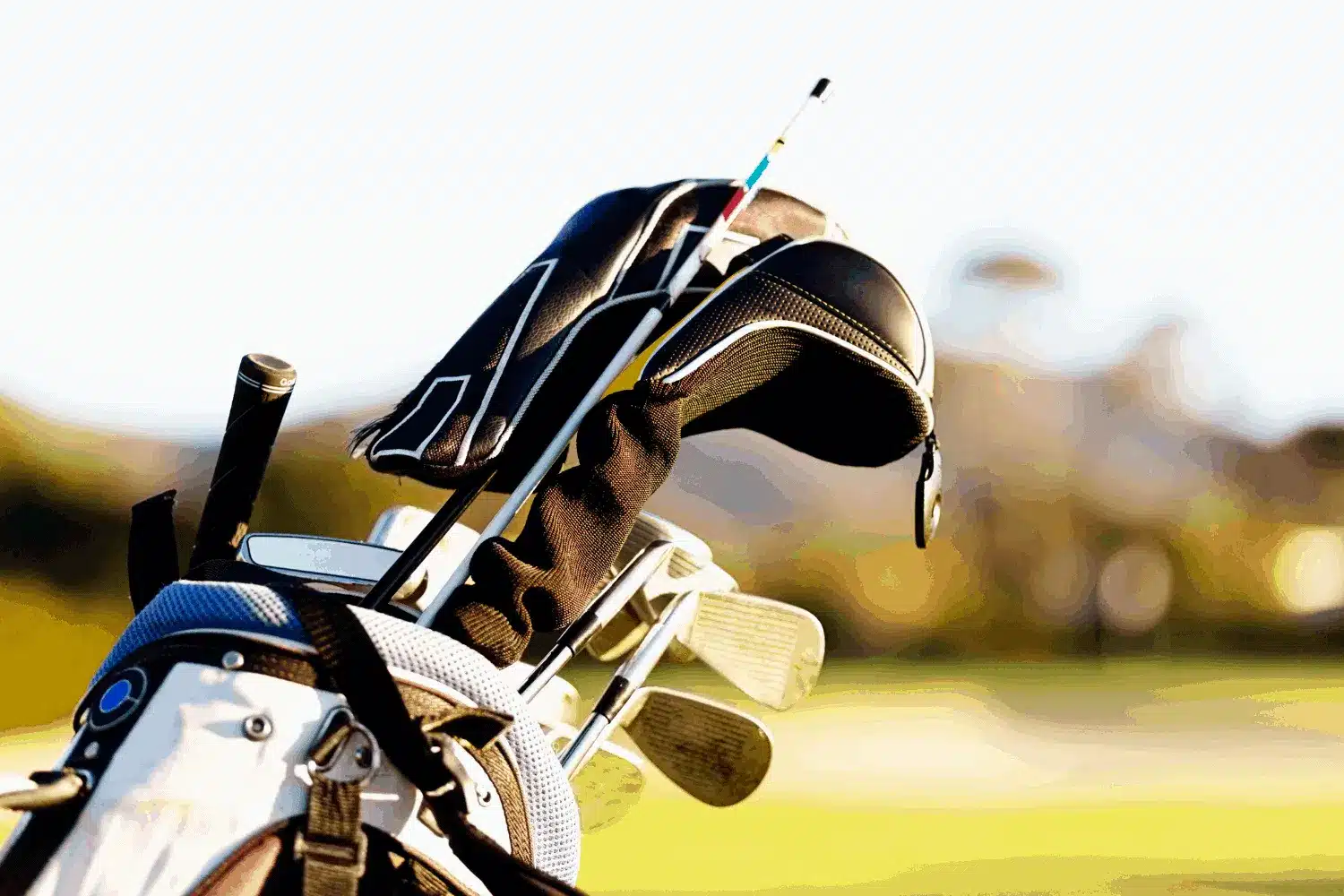 a golf bag with gold essentials