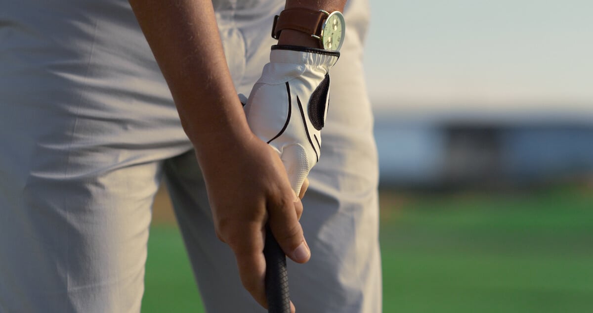 close up shot of a person s hand while playing golf