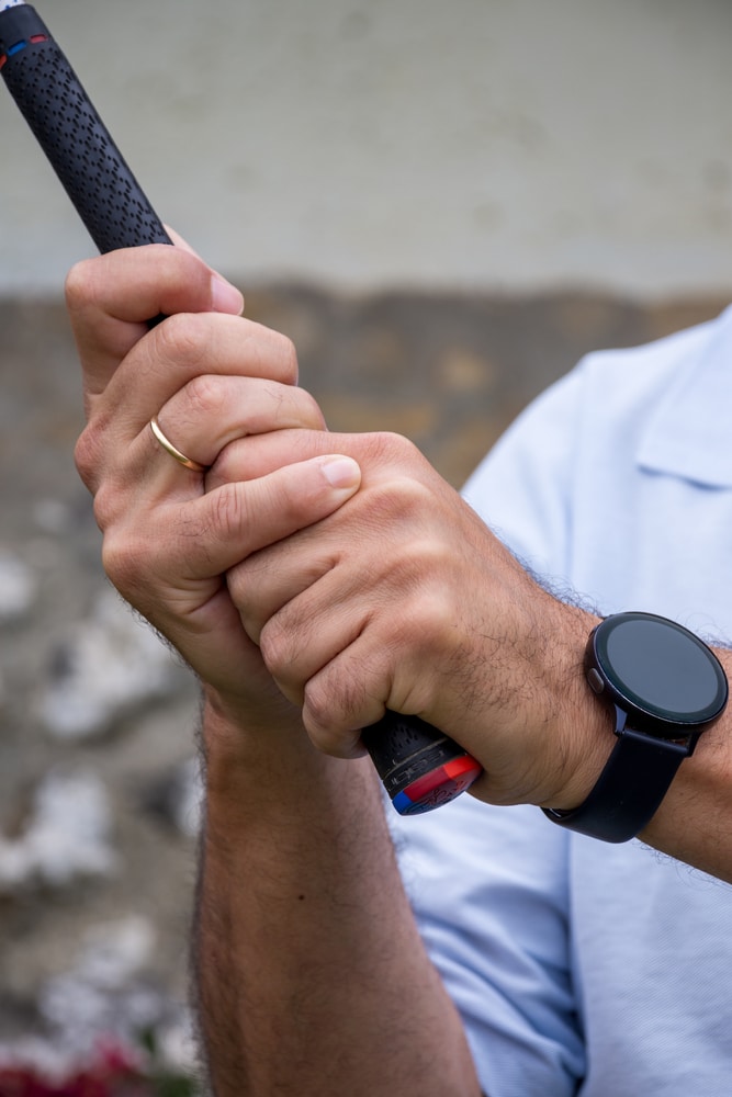 Close up Of Hands Of Married Man With Black Digital Watch